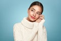 Young beautiful woman in a warm white sweater