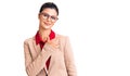 Young beautiful woman wearing business shirt and glasses cheerful with a smile of face pointing with hand and finger up to the Royalty Free Stock Photo