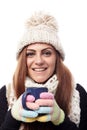 Young beautiful woman wearing cap, scarf and gloves and holding Royalty Free Stock Photo