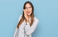 Young beautiful woman wearing casual clothes hand on mouth telling secret rumor, whispering malicious talk conversation Royalty Free Stock Photo