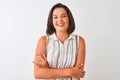 Young beautiful woman wearing casual striped shirt standing over isolated white background happy face smiling with crossed arms Royalty Free Stock Photo