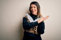 Young beautiful woman wearing casual sweatshirt standing over isolated white background clapping and applauding happy and joyful, Royalty Free Stock Photo