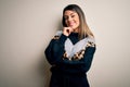 Young beautiful woman wearing casual sweatshirt standing over isolated white background looking confident at the camera smiling Royalty Free Stock Photo