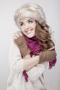 Young beautiful woman wearing fur hat and scarf Royalty Free Stock Photo