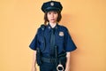 Young beautiful woman wearing police uniform depressed and worry for distress, crying angry and afraid Royalty Free Stock Photo