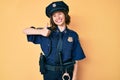 Young beautiful woman wearing police uniform doing happy thumbs up gesture with hand Royalty Free Stock Photo