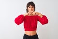 Young beautiful woman wearing red summer t-shirt standing over isolated white background Rejection expression crossing fingers Royalty Free Stock Photo