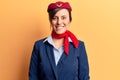 Young beautiful woman wearing stewardess uniform with a happy and cool smile on face