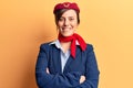 Young beautiful woman wearing stewardess uniform happy face smiling with crossed arms looking at the camera