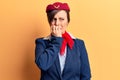 Young beautiful woman wearing stewardess uniform looking stressed and nervous with hands on mouth biting nails