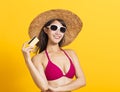 Young beautiful woman wearing swimsuit bikini and showing credit card Royalty Free Stock Photo