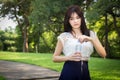 Young beautiful woman wearing white shirts drinking water at su Royalty Free Stock Photo