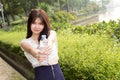 Young beautiful woman wearing white shirts drinking water at su Royalty Free Stock Photo