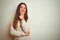 Young beautiful woman wearing winter turtleneck sweater over isolated white background looking confident at the camera smiling Royalty Free Stock Photo