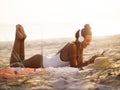 Woman in Bikini with a Smartphone and Headphones on the Beach Royalty Free Stock Photo