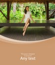 Young and beautiful woman in white dress. Woman posing in exotic Thai bungalow. Resting and traveling concept.