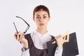 Young beautiful woman on white isolated background, teacher, documents, emotions, portrait Royalty Free Stock Photo