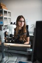 Young beautiful woman work in students laboratory. Student working in lab. Royalty Free Stock Photo