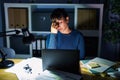 Young beautiful woman working at the office at night tired rubbing nose and eyes feeling fatigue and headache Royalty Free Stock Photo