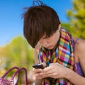 Young beautiful woman writes an SMS Royalty Free Stock Photo