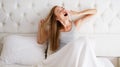 Young Beautiful Woman Yawning In Bed At Home : Relax Comfort Sleep Concept Royalty Free Stock Photo