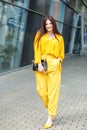 Young beautiful woman in yellow clothes. Concept of lifestyle, business, beauty and fashion