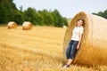 Young beautiful woman on yellow golden hay field, Germany Royalty Free Stock Photo