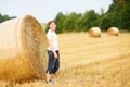 Young beautiful woman on yellow golden hay field, Germany Royalty Free Stock Photo