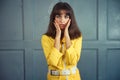 Young beautiful woman in yellow work suit