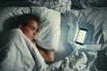 Young beautiful womanl in bed using mobile phone late at night at dark bedroom, internet addiction concept Royalty Free Stock Photo