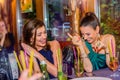 Young beautiful women with cocktails in bar or club Royalty Free Stock Photo