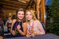 Young beautiful women with cocktails in bar or club Royalty Free Stock Photo