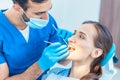 Beautiful woman looking with confidence at her reliable dentist