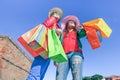 Young beautiful women sharing free time having fun and shopping in the old town in a sunny day - Best hipster friends enjoying Royalty Free Stock Photo