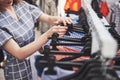 Young beautiful women at the weekly cloth market - Best friends sharing free time having fun and shopping Royalty Free Stock Photo