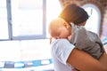 Young beautifull woman and her baby standing on the floor at home Royalty Free Stock Photo