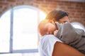 Young beautifull woman and her baby standing on the floor at home Royalty Free Stock Photo