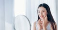 Young Beauty Asian Woman Looking at Mirror Check Clear Face Royalty Free Stock Photo