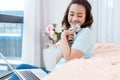 Young beauty Asian woman working on laptop at apartment condominium home with kitten cat pet. Royalty Free Stock Photo