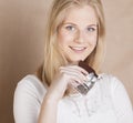 Young beauty blond teenage girl eating chocolate Royalty Free Stock Photo