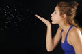 Young beauty blowing particles isolated