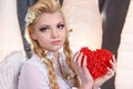 Young beauty girl angel holding the heart Royalty Free Stock Photo