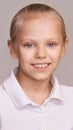 Young beauty girl portrait. Look at camera. Neutral background