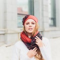 Young beauty outdoor portrait with autumn park in background hat. Royalty Free Stock Photo