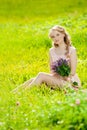 Young beauty smiling woman in the field, on the grass. Girl rest Royalty Free Stock Photo