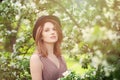 Young Beauty in Spring Sunlight. Healthy Woman on Blossom