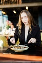 Young beauty Woman eating plate of salad at cafe shop Royalty Free Stock Photo