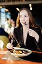 Young beauty Woman eating plate of salad at cafe shop Royalty Free Stock Photo