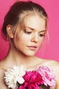 Young beauty woman with flower peony pink closeup makeup soft tender gentle look Royalty Free Stock Photo