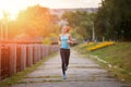 Young beauty woman running in park in the morning Royalty Free Stock Photo